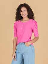 Camiseta rosada manga al codo